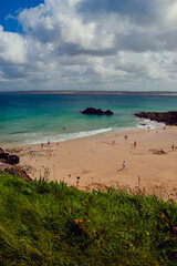 Holidaymakers on Bamaluz Beach, St Ives, Cornwall in Summer