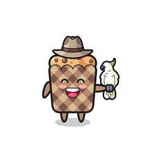 muffin zookeeper mascot with a parrot