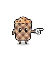muffin mascot with pointing right gesture