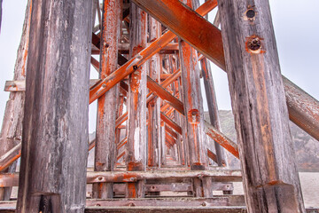 Weathered Bridge on Foggy California Beach