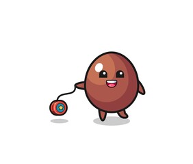 cartoon of cute chocolate egg playing a yoyo
