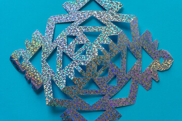 cut glitter paper shape on blue