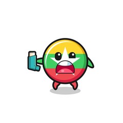 myanmar flag mascot having asthma while holding the inhaler