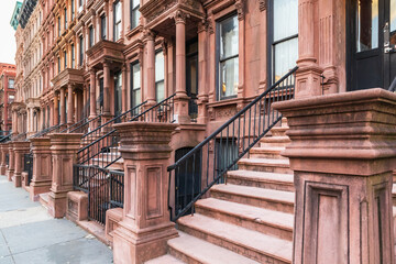 Steps on brownstone houses in Harlem. - obrazy, fototapety, plakaty