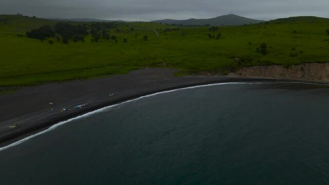 Aerial view from sea of the Black Sands, Mountains, hlls and rocky in the afternoon