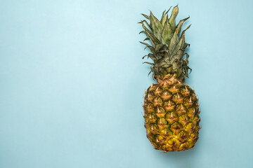 Creative layout of pineapple on a blue background. Flat lay. Food concept. Macro concept. 