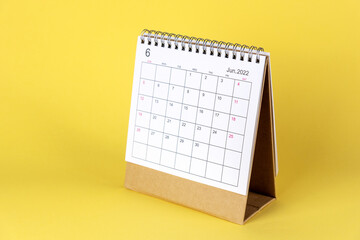 The June 2022 desk calendar with yellow background. Hello June English calendar. welcome Month of...