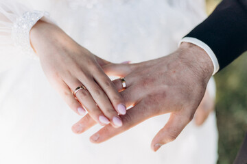 bride and groom holding hands