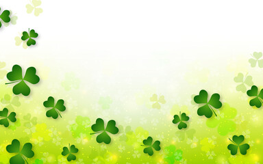 St.Patrick's Day blurred vector background with clover leaves and light effects