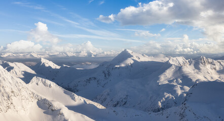 Aerial Panoramic View of Canadian Mountain covered in snow. Sunny winter season with cloudy sky art render. Located near Whistler, North of Vancouver, British Columbia, Canada. Nature Background