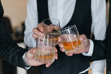 person holding a glass of whiskey