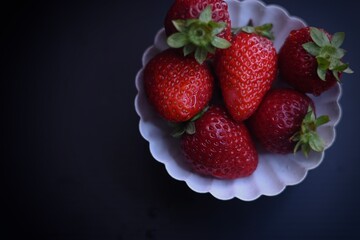 strawberries on a black background