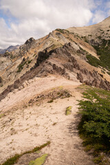 View of the hiking path at the peak of Bella Vista hill in Bariloche, Patagonia Argentina. The rocky mountaintop in a sunny day. 