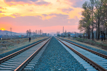 Fototapeta premium Railway in the Background of Sunset
