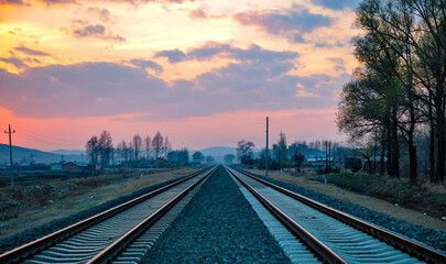 Fototapeta premium Railway in the Background of Sunset