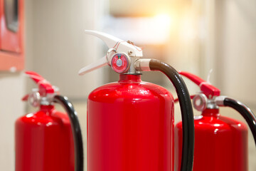 Fire extinguisher, Close-up red fire extinguishers tank in the building concepts of protection and prevent for emergency and safety rescue and fire training.