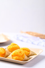 Homemade Toddy palm cake on natural plate with white background, Thai traditional dessert