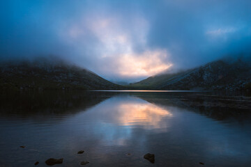 Panorama reflection view of Lago de Enol alpine mountain lakes of Covadonga Picos de Europa Asturias Spain Europe