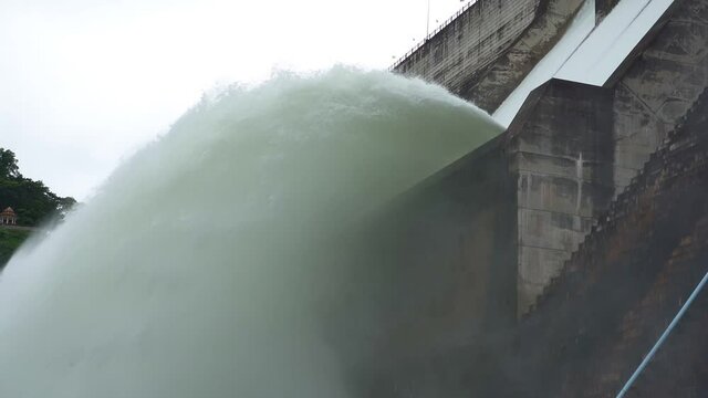 Hydroelectric dam Floodgate with flowing water through gate and Open the springway Khun Dan Prakan Chon Dam in nakhon nayok Thailand