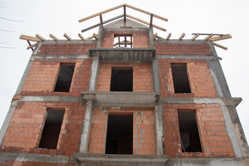 brick house under construction in Bistrita, concrete belts for brick construction  Romania, 2022, January 