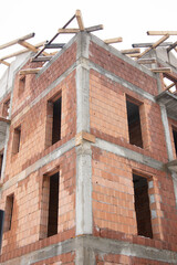 brick house under construction in Bistrita, concrete belts for brick construction  Romania, 2022, January 