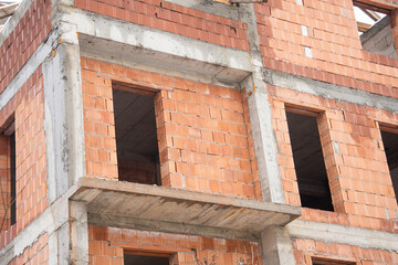brick house under construction in Bistrita, concrete belts for brick construction  Romania, 2022, January 
