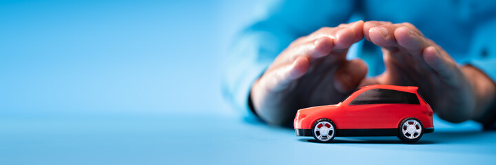 Hand Protecting Red Toy Car