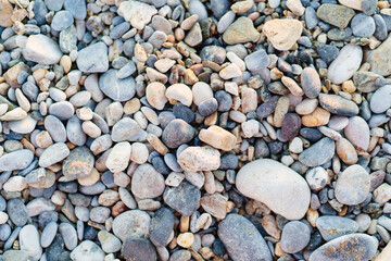 gray pebbles. pebble beach. stones for landscape design. background.