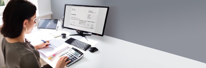Accountant calculating tax at desk