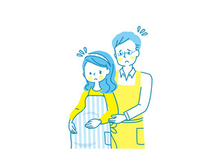 お腹の中の赤ちゃんを心配する妊婦と寄り添う夫