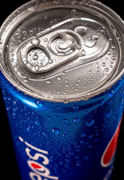 Close-up of a 250ml can of Pepsi with water drops. Top view.