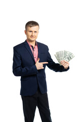 business man in a suit. a young man holds dollars and rejoices. the man laughs cheerfully, he is pleased with his earnings. businessman got holding a lot of money. isolated