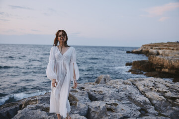 pretty woman in white dress and travel lifestyle landscape stones