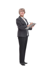 Side view of senior stylish businesswoman writing on clipboard