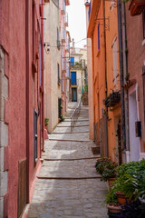Naklejka na ściany i meble Colorful street of Collioure in city in France