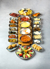 Traditional turkish Full English Breakfast - sunny-side-up fried eggs, sausages, beans, mushrooms and bacon