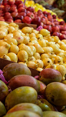 Yellow guava fruits, apples, and mango at the Egyptian farmers market