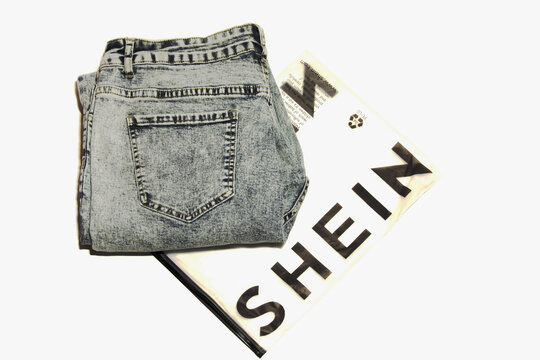 Blue jeans from the online clothing store Shein. Isolated on a white background
