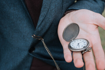Man in suit with pocket watch in hand