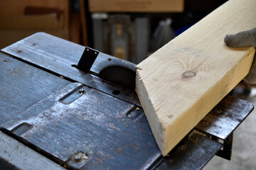Silver circular saw in the garage at work