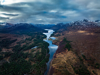 Aerial view of Glen Affric in the highlands of Scotland near Inverness and Canich showing the flat calm lochs amongst Munro mountains