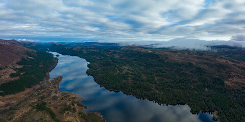 Obraz premium Aerial view of Glen Affric in the highlands of Scotland near Inverness and Canich showing the flat calm lochs amongst Munro mountains