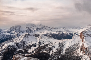 Stormy clouds in italian dolomites in a snowy winter