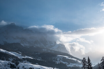 Stormy clouds in italian dolomites in a snowy winter