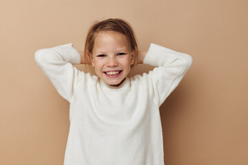cute girl in white sweater posing hand gestures childhood unaltered