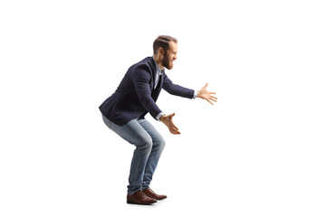 Full length profile shot of a man waiting with arms wide open