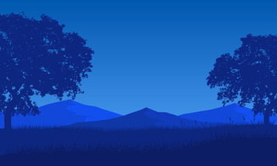 Stunning mountain view at night with pine tree silhouettes all around