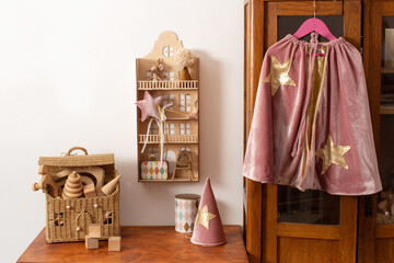 vintage interior in the children's room, wooden toys on the table, children's play table