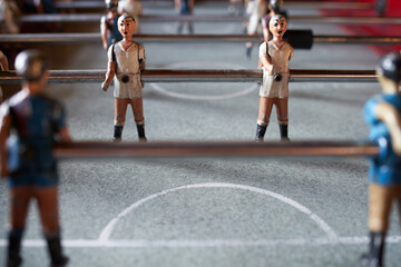Figures' detail of an old disused table football in a village bar, antique board game and entertainment.