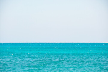 Fototapeta na wymiar Closeup seascape surface of blue sea water with small ripple waves